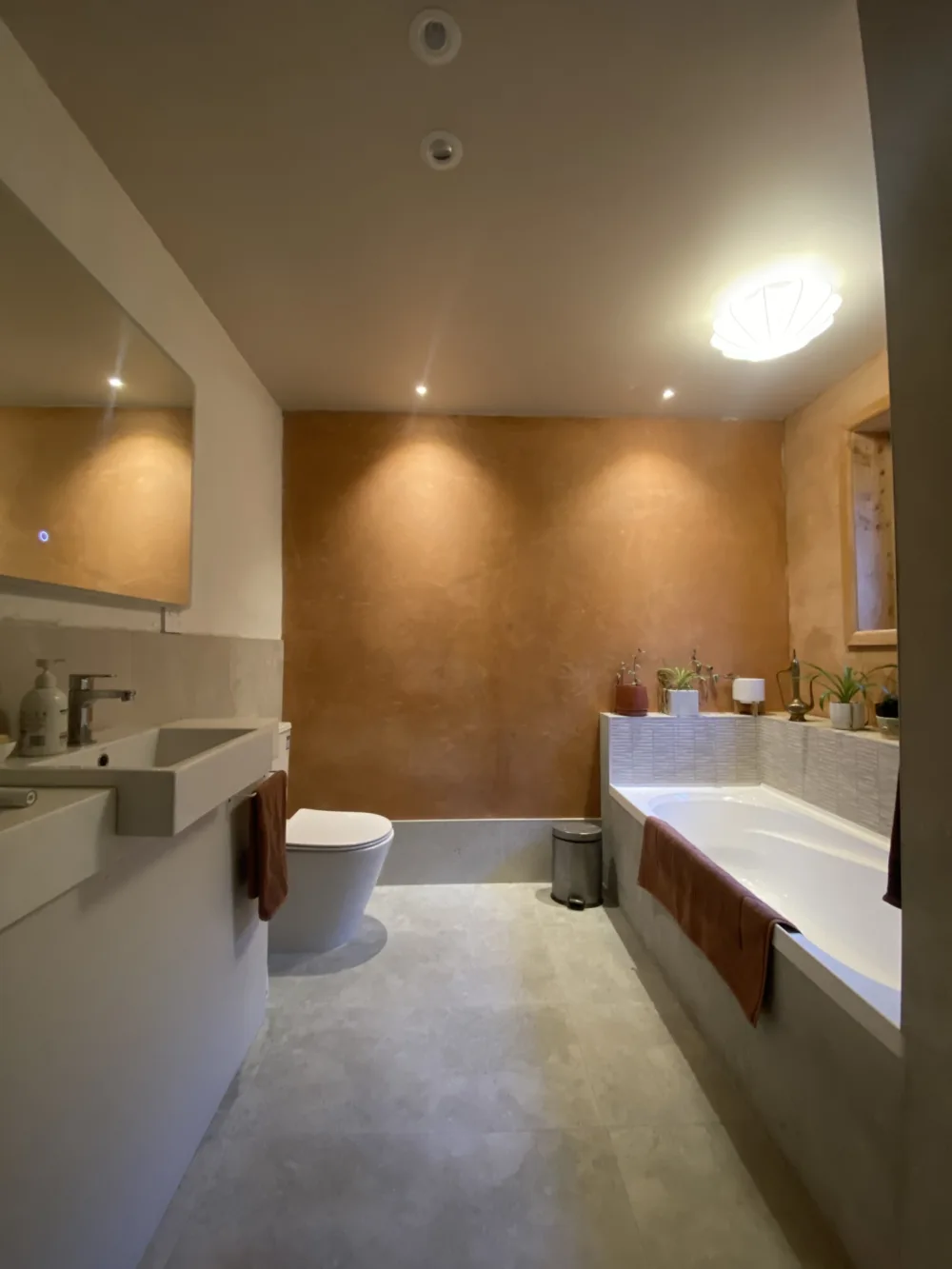 The bathroom, featuring attractive slip-resistant tiles.